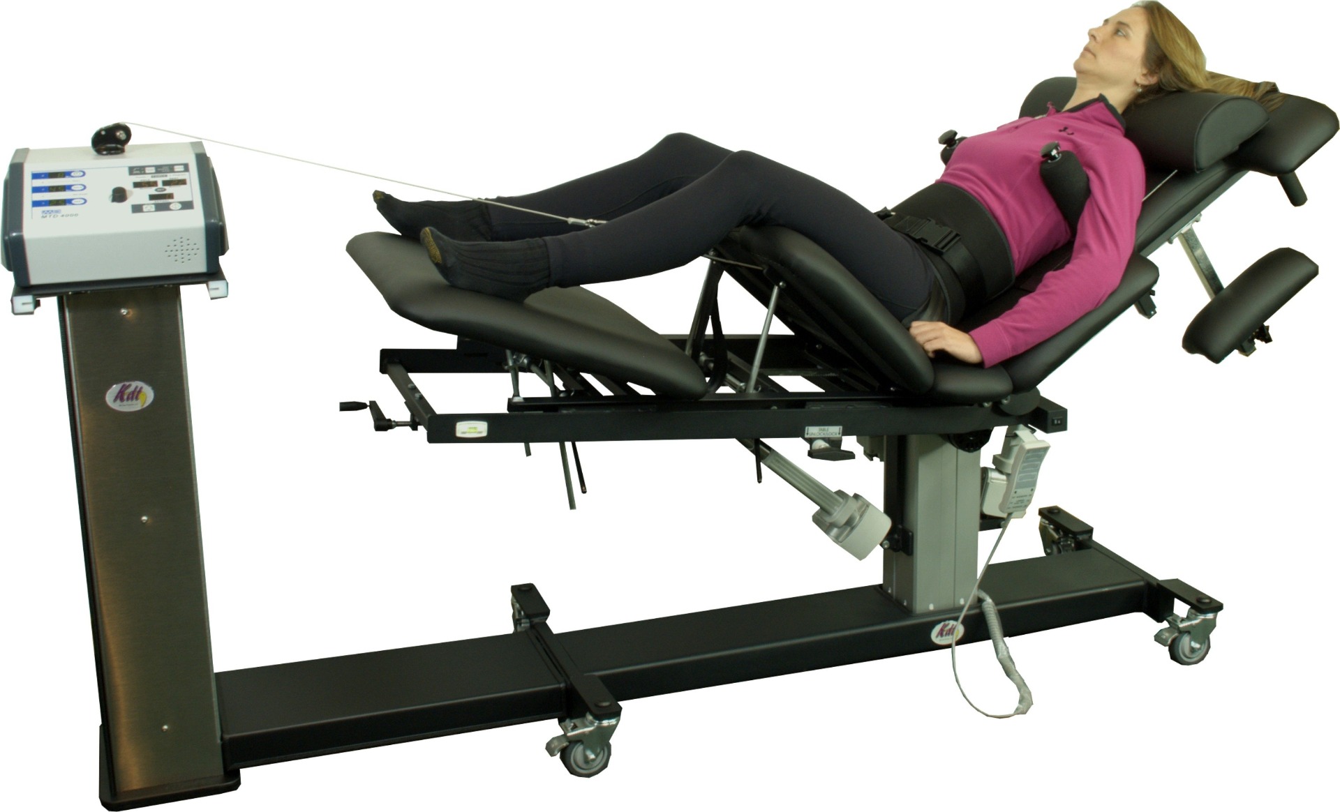 Patient receiving non-surgical spinal decompression therapy on a specialized treatment table
