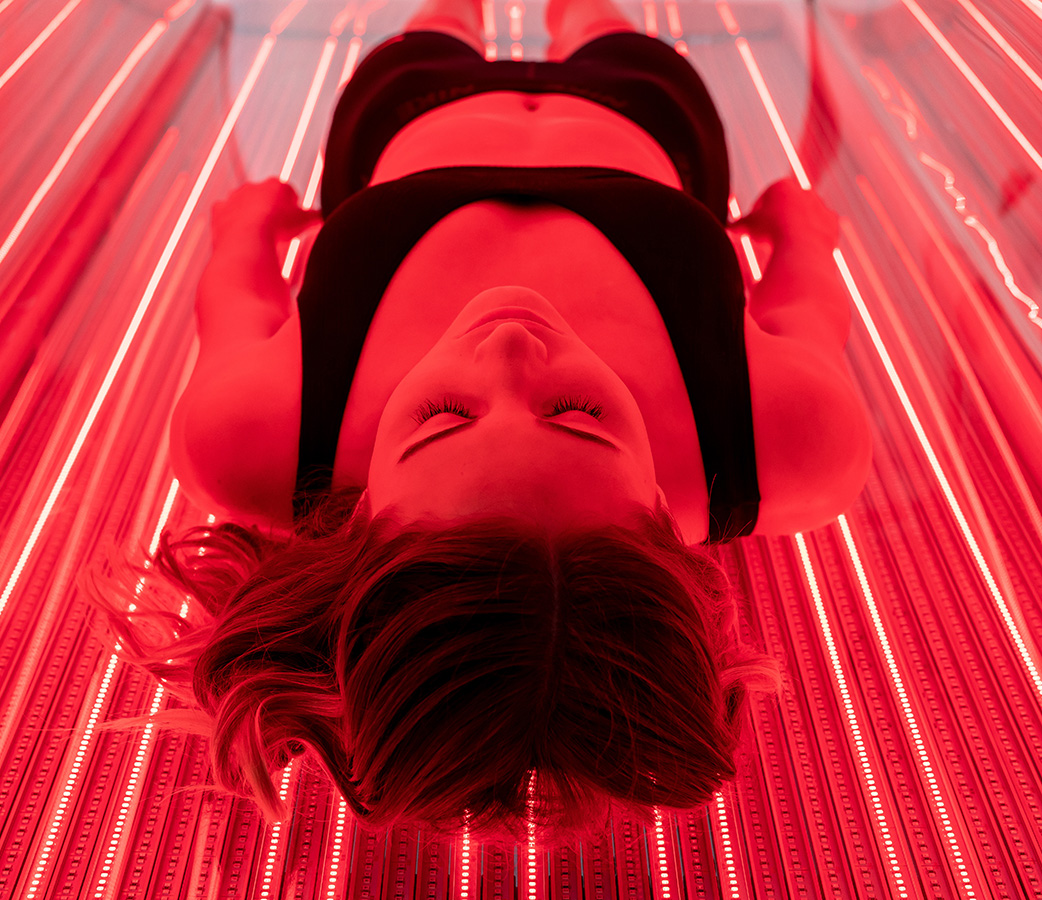 Woman Red Light Therapy Bed Dallas
